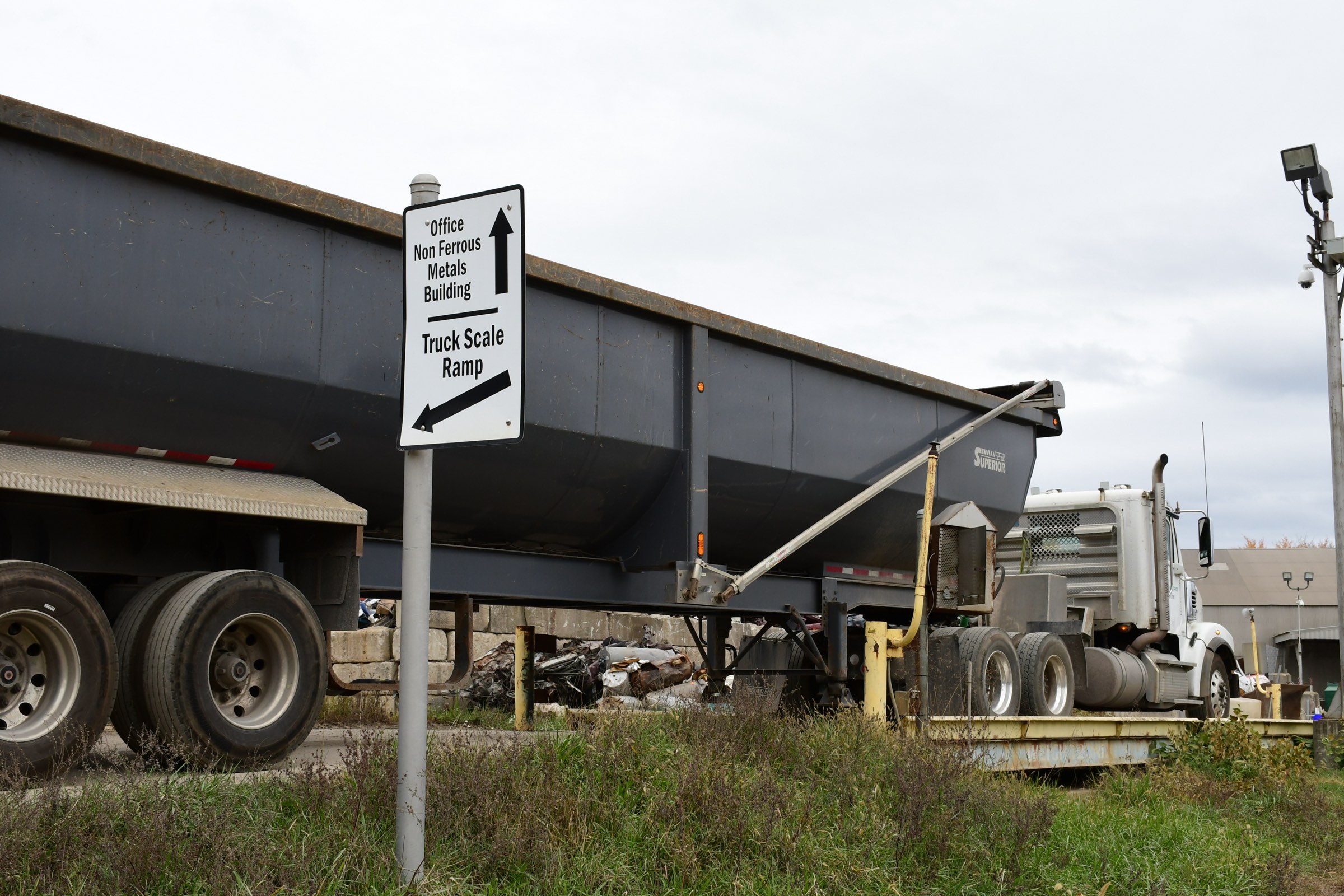 Directional sign at the Washington yard pointing to the office, non-ferrous building, and truck scale ramp